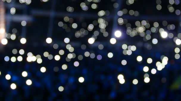 Bokeh menigte met lichten op het concert - Video
