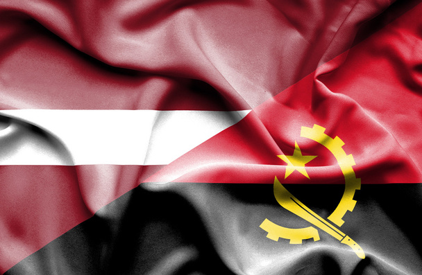Waving flag of Angola and Latvia - Photo, Image