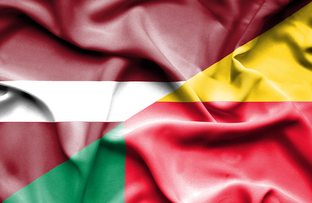 Waving flag of Benin and Latvia - Photo, Image