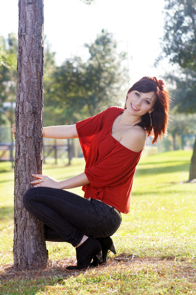 Beautiful Young Woman Leaning on a Tree (3) - Zdjęcie, obraz