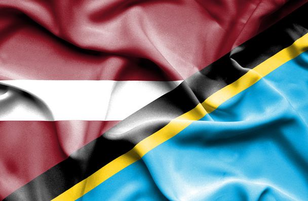 Waving flag of Tanzania and Latvia - Photo, Image