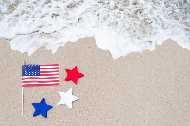American flag with stars on the sandy beach - Photo, Image