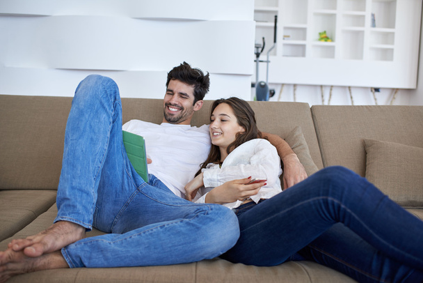 couple at modern home using tablet computer - Φωτογραφία, εικόνα