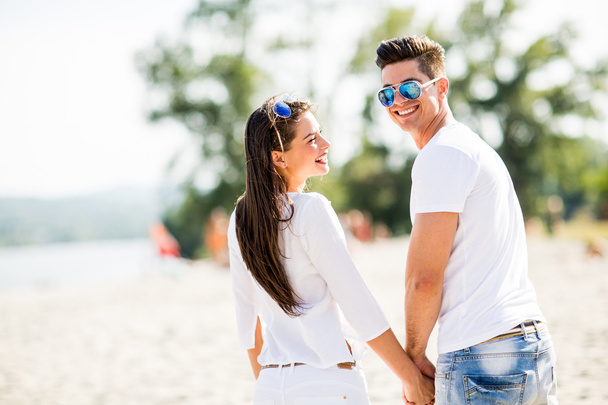 Young couple on the beach - Photo, image