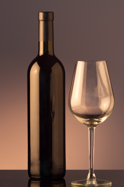 A glass and bottle of red wine  - Photo, image