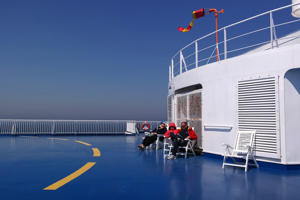 Finnstar, Baltic Sea - May 17, 2013: Passengers resting on the upper deck of the ferry - Photo, image