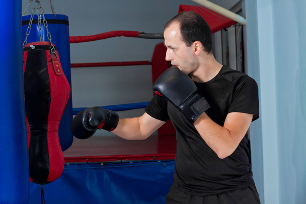 Boxer preparing to punch - Fotoğraf, Görsel