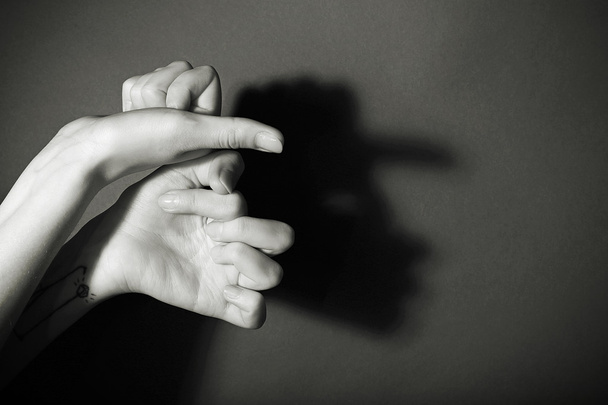 Hands gesture like man face on gray background - Фото, зображення