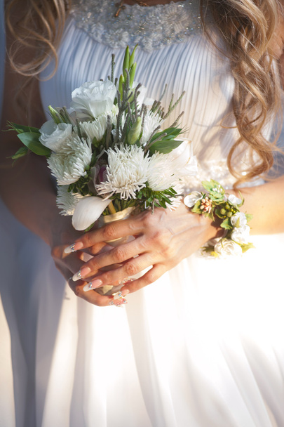 Buquê de casamento em mãos
 - Foto, Imagem