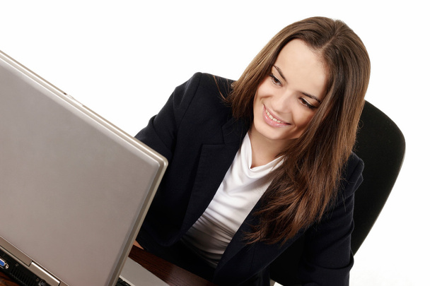Young woman using laptop - Fotó, kép