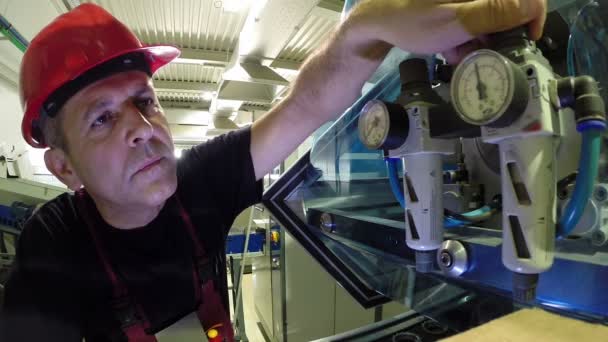 Engineer Adjusts the Pressure Regulator on the Machine - Footage, Video