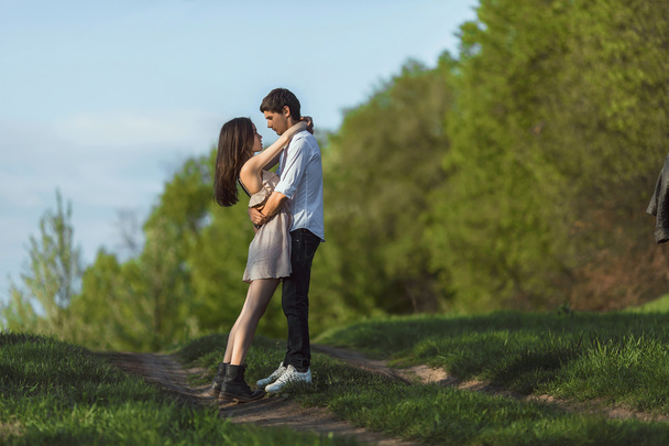 Beautiful young couple in love outdoors - Фото, зображення