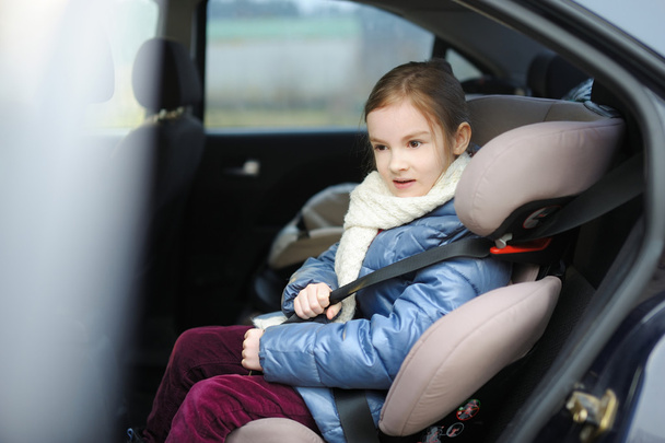 little girl sitting in  car seat - Photo, Image