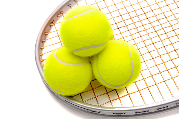 Tennis balls on racket - Fotoğraf, Görsel