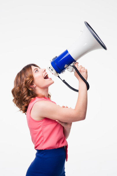 Casual woman shouting in megaphone - Foto, afbeelding