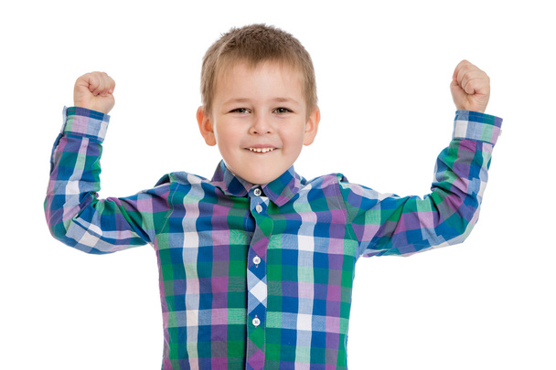 Positive little boy in a plaid shirt raised his hands up , close - Фото, зображення