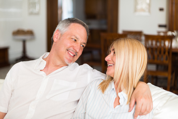 mature couple talking in their home - Photo, Image