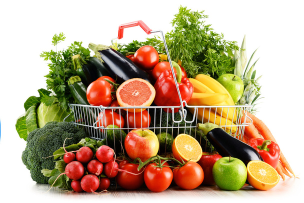 Organic vegetables and fruits in shopping basket on white - Photo, Image