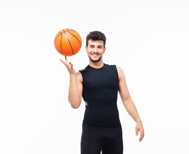 Basketball player spinning ball on his finger - Φωτογραφία, εικόνα