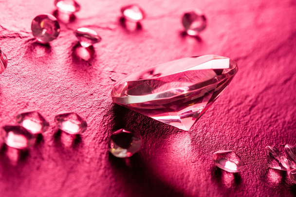 Different diamonds in pink light - Photo, image