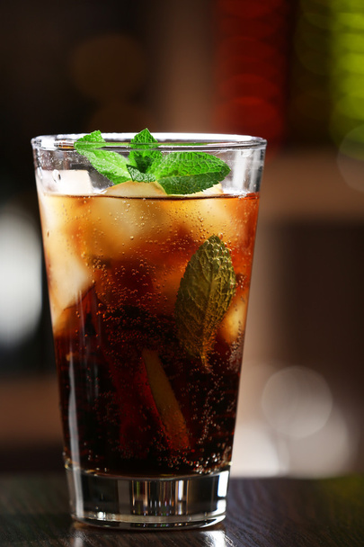 Glass of cocktail in bar on bright blurred background - Zdjęcie, obraz
