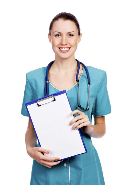 Pretty female doctor or nurse with clipboard. - Photo, Image