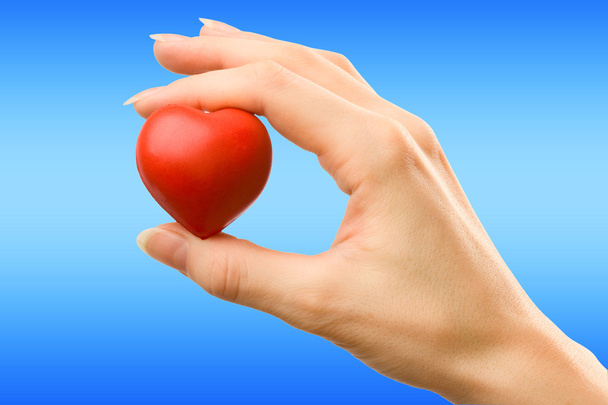 Жіноча рука з червоним серцем
 - Фото, зображення