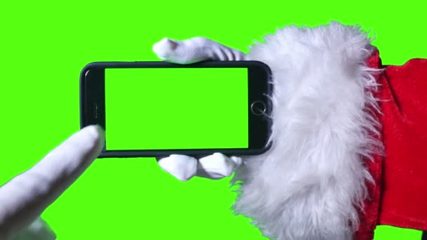 Αϊ-Βασίλη, χρησιμοποιώντας μια πράσινη οθόνη smartphone - Πλάνα, βίντεο