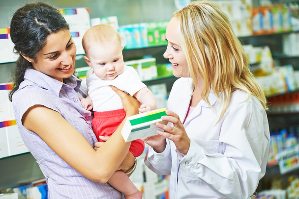 Pharmacy chemist, mother and child in drugstore - Foto, immagini