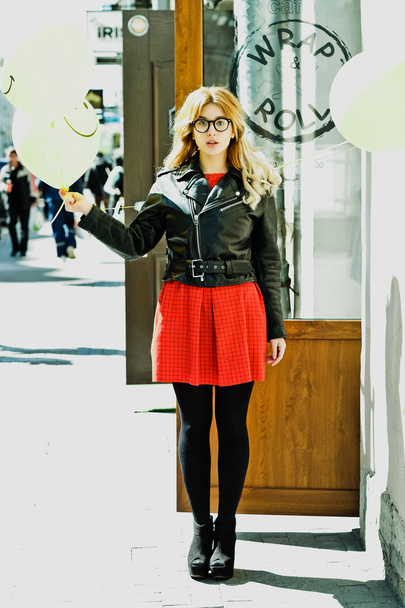 young hipster woman with balloon in the city - 写真・画像