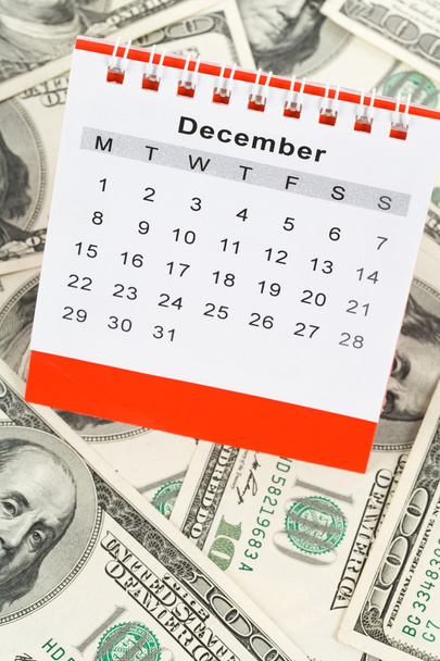 Calendario y dólar
 - Foto, imagen