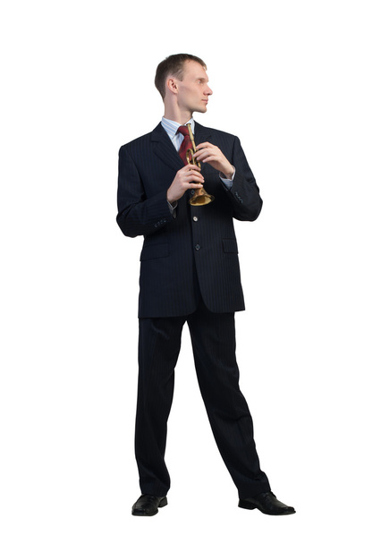 Businessman plays fife - Zdjęcie, obraz