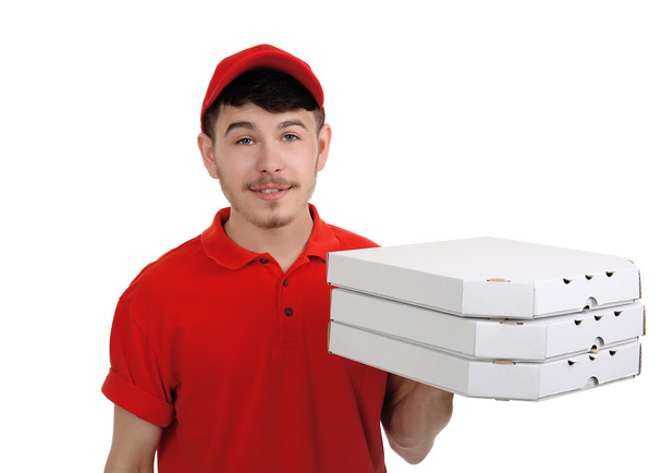 Delivery boy with cardboard pizza box isolated on white - 写真・画像