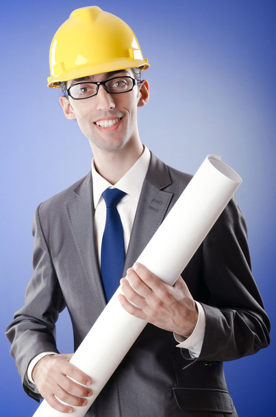 Young architect with drawings and hardhat - Photo, Image