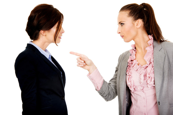Angry businesswoman accuses her partner. - 写真・画像