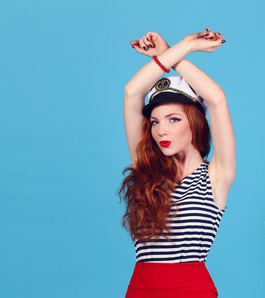 Adorable model wearing sea admirals hat and sexy top - Photo, image
