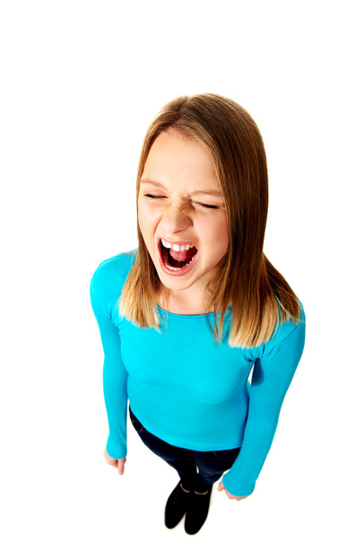 Screaming young woman - Фото, изображение