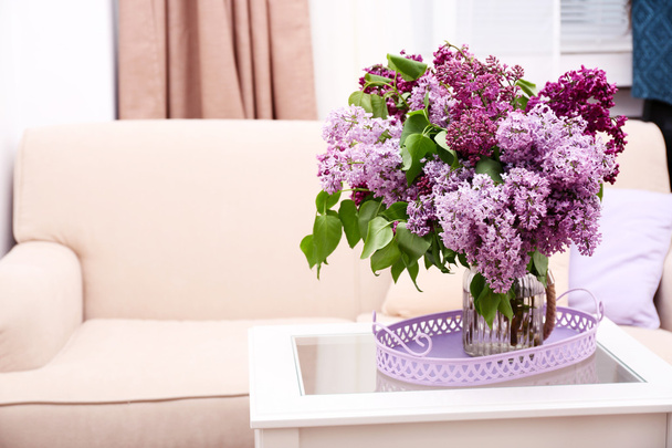 Beautiful lilac flowers in vase on table - Fotografie, Obrázek