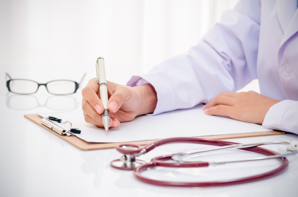 doctor writing medical record - Photo, Image