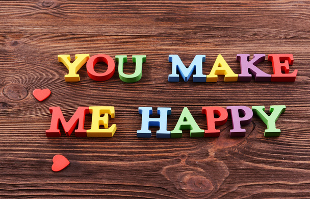 Inscription YOU MAKE ME HAPPY made of colorful letters - Фото, зображення
