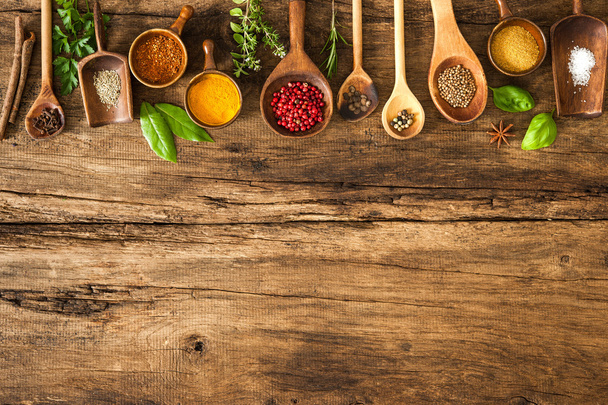 Colorful spices on wooden table - 写真・画像