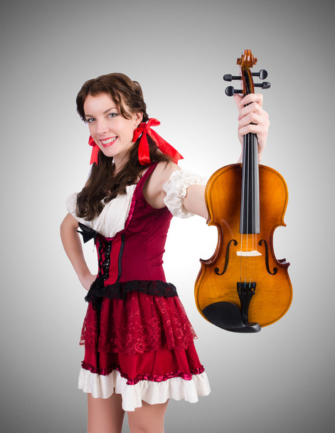Nainen, jolla on viulu kaltevuutta vasten
 - Valokuva, kuva