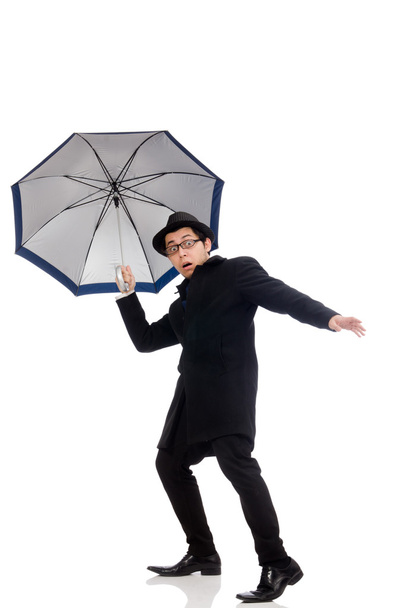 muž v plášti s deštníkem - Fotografie, Obrázek