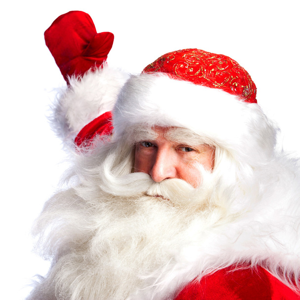 Santa Claus pointing his hand isolated over white. - 写真・画像
