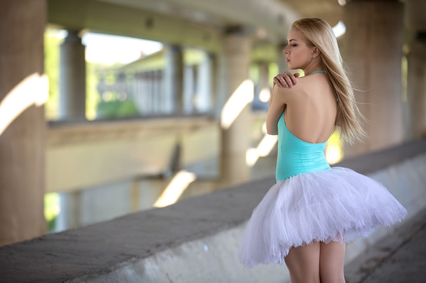 Graceful ballerina in the industrial background - Φωτογραφία, εικόνα