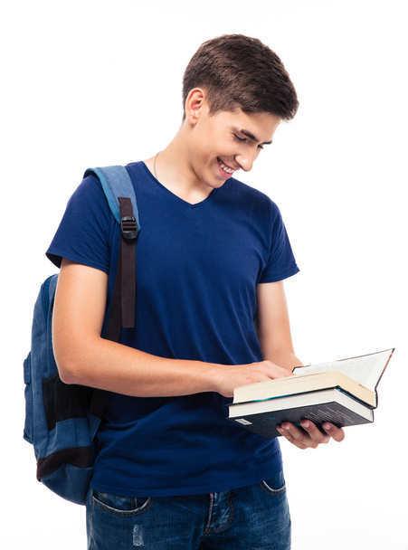 Smiling male student reading book  - 写真・画像