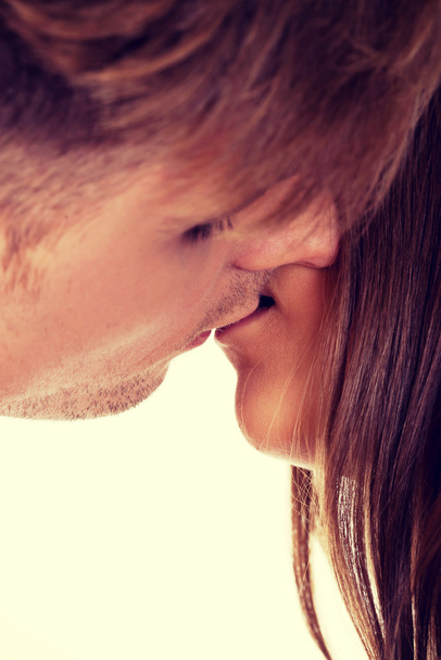 Young couple kissing. - Foto, afbeelding