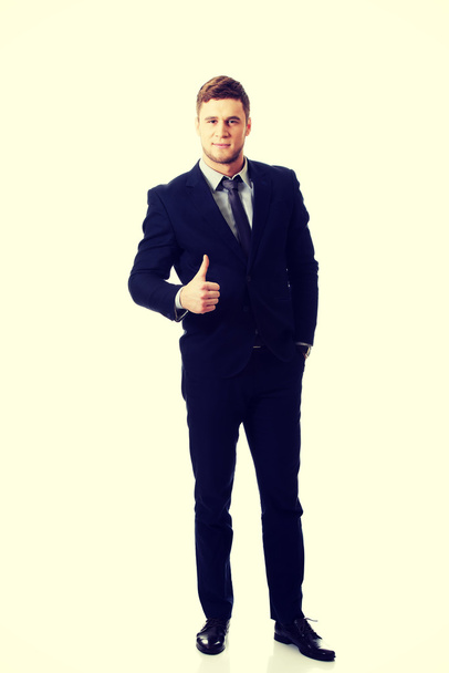 Happy smiling businessman with thumbs up. - Foto, Imagen