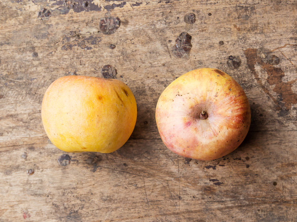 Still life with old apple on wooden background - Photo, Image