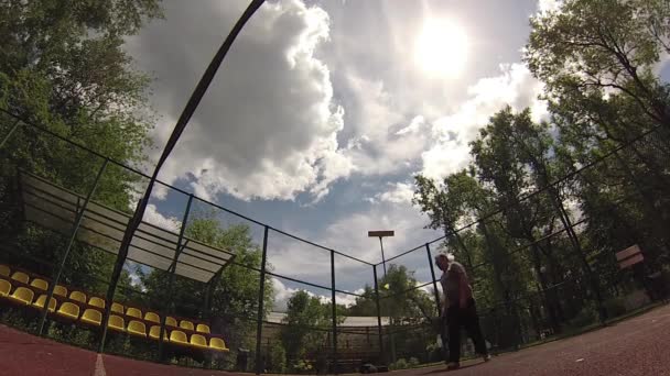 two men playing Badminton on court - Кадри, відео